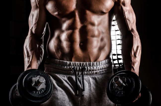 fit guy lifting weights